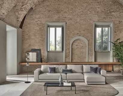 Divano in ecopelle con penisola Pitagora di Bontempi